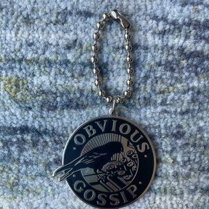 KD LANG Obvious Gossip metal silver keychain